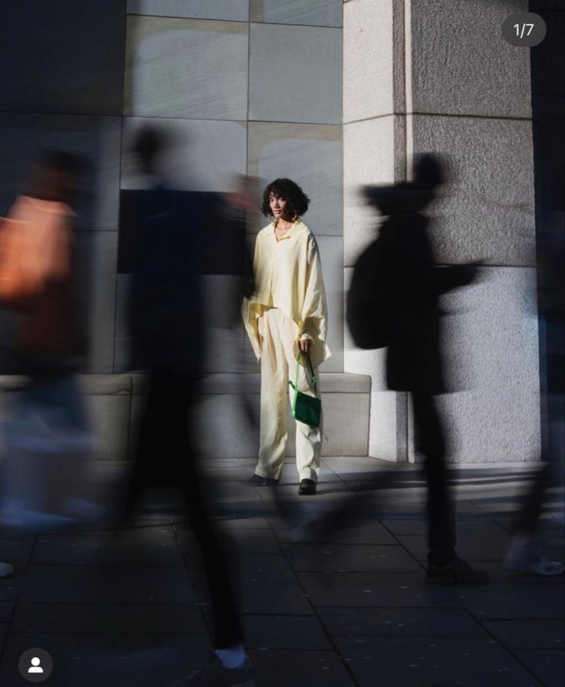 Fashion figures in motion on a city street